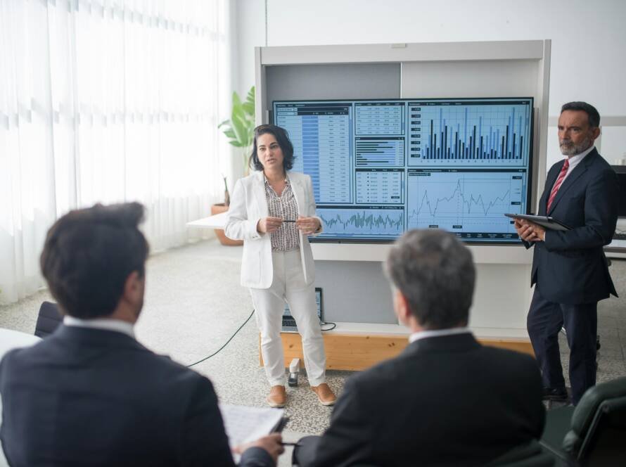 Revenue leader presenting performance analytics to hotel executives — symbolizing data-driven decision-making and fractional leadership in hospitality.